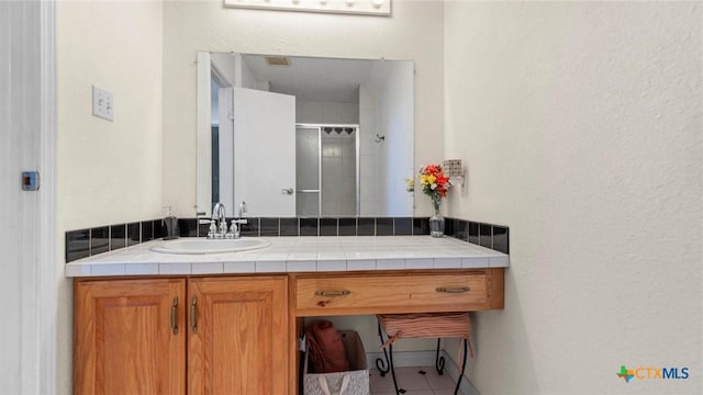 689 Abels Way, Canyon Lake, TX 78133 - bathroom with vanity, tile patterned flooring, and a shower with door