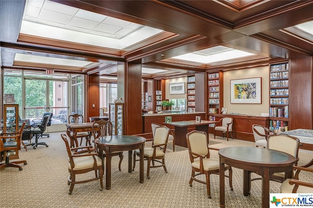 carpeted dining area featuring crown molding and coffered ceiling