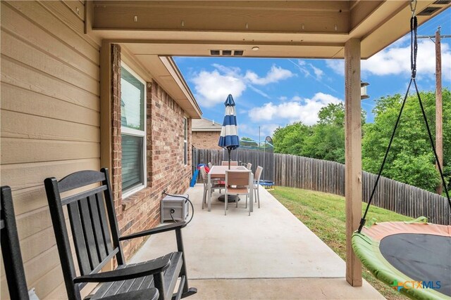 6402 Castle Gap Dr, Killeen, TX 76549 - fenced backyard with outdoor dining space and a patio
