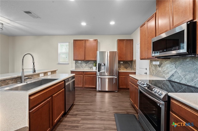 220 Hinge Crk, Cibolo, TX 78108 - kitchen featuring stainless steel appliances, a sink, dark wood-type flooring, tasteful backsplash, and light countertops