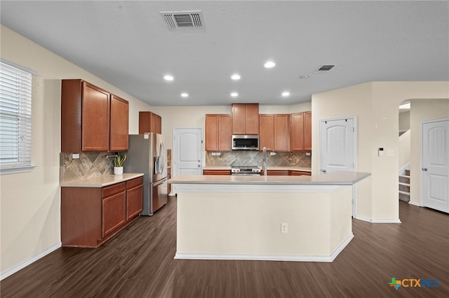 220 Hinge Crk, Cibolo, TX 78108 - kitchen with appliances with stainless steel finishes, dark wood-style floors, tasteful backsplash, and recessed lighting