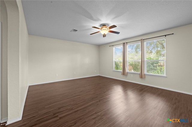 220 Hinge Crk, Cibolo, TX 78108 - spare room featuring ceiling fan, dark wood-style floors, baseboards, and a textured ceiling