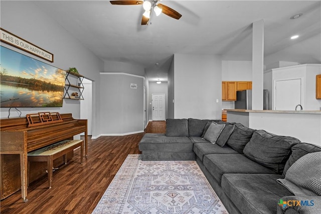 7317 Galleta Ct, Temple, TX 76502 - living area with a ceiling fan, dark wood-style floors, and baseboards