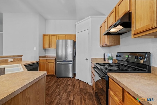 7317 Galleta Ct, Temple, TX 76502 - kitchen with black appliances, under cabinet range hood, dark wood-style flooring, and light countertops