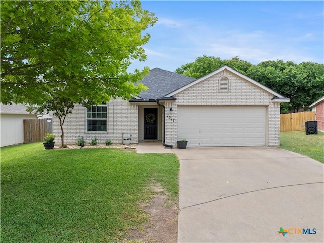 7317 Galleta Ct, Temple, TX 76502 - view of front of property with brick siding, a garage, concrete driveway, and a shingled roof