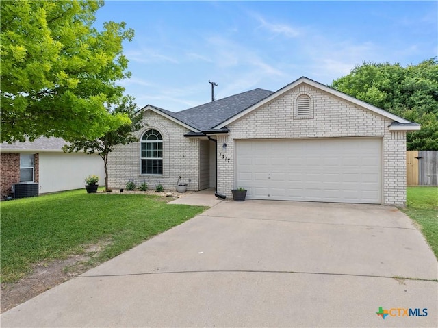 7317 Galleta Ct, Temple, TX 76502 - single story home with brick siding, an attached garage, driveway, and roof with shingles