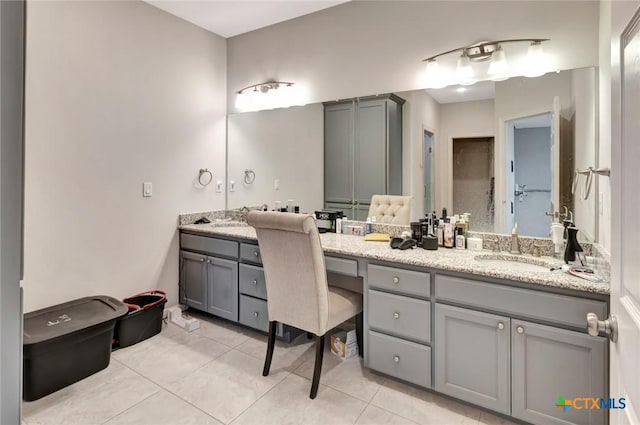 bathroom with tile patterned flooring and vanity