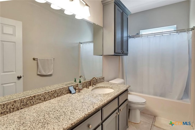 bathroom featuring vanity, tile patterned floors, toilet, and shower / bath combo