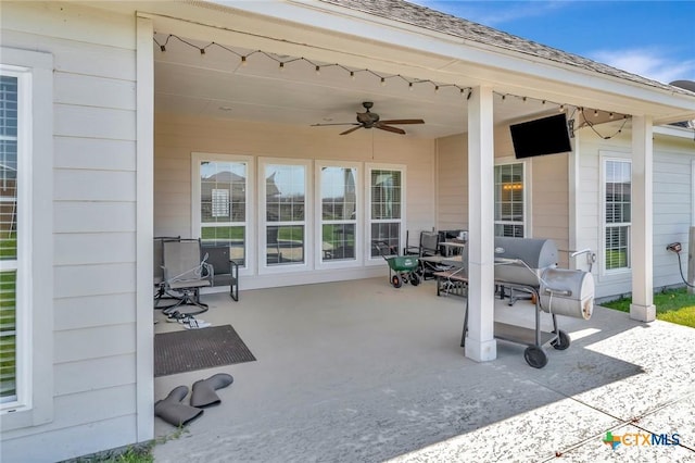 view of patio featuring ceiling fan