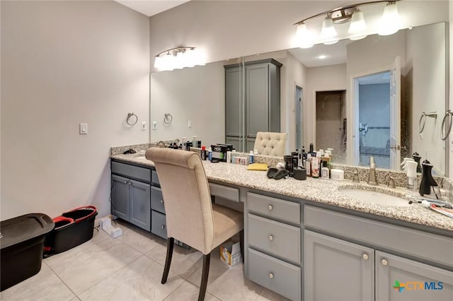 full bathroom featuring vanity and tile patterned flooring