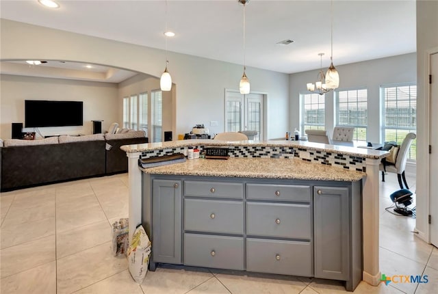 kitchen with visible vents, plenty of natural light, and gray cabinetry