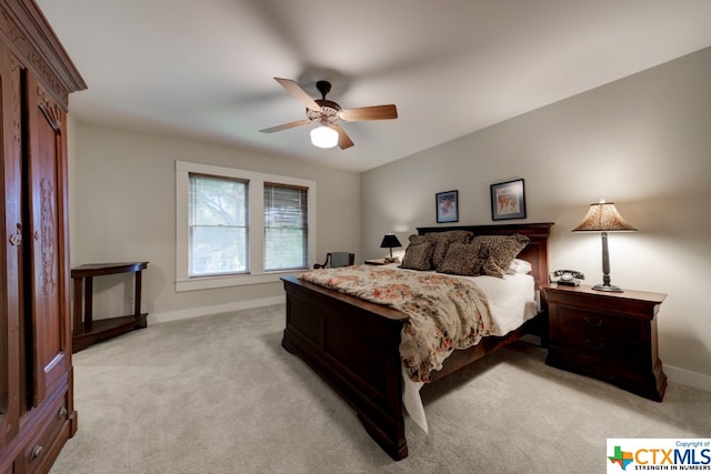 bedroom featuring ceiling fan and light colored carpet