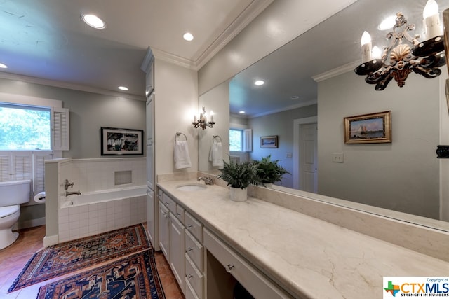 bathroom featuring vanity, crown molding, a relaxing tiled tub, and toilet