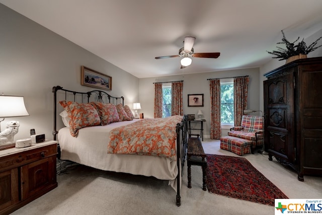 bedroom featuring light colored carpet and ceiling fan