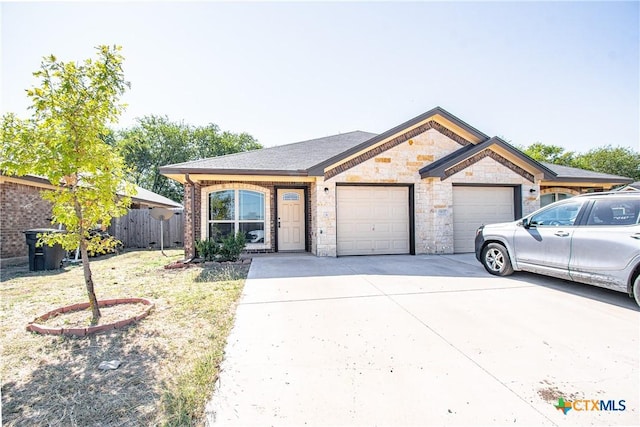 607 Sladecek Dr, Killeen, TX 76542 - view of front facade with a garage, driveway, and stone siding