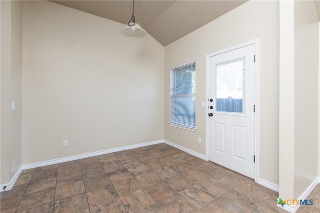 607 Sladecek Dr, Killeen, TX 76542 - unfurnished dining area featuring vaulted ceiling, baseboards, and stone finish floors