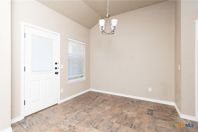 607 Sladecek Dr, Killeen, TX 76542 - unfurnished dining area featuring a chandelier, stone finish floors, vaulted ceiling, and baseboards