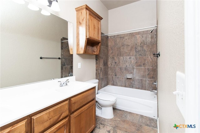 607 Sladecek Dr, Killeen, TX 76542 - bathroom featuring toilet, bathtub / shower combination, vanity, and stone finish flooring