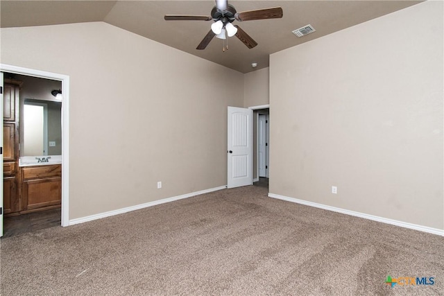 607 Sladecek Dr, Killeen, TX 76542 - unfurnished bedroom with carpet flooring, lofted ceiling, baseboards, and ensuite bath
