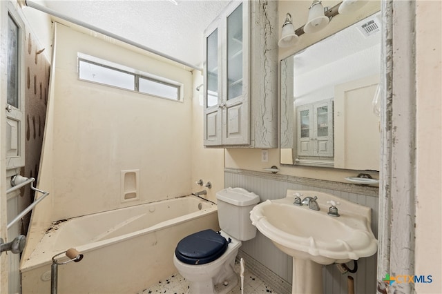 full bathroom with tile patterned flooring, sink, toilet, and  shower combination