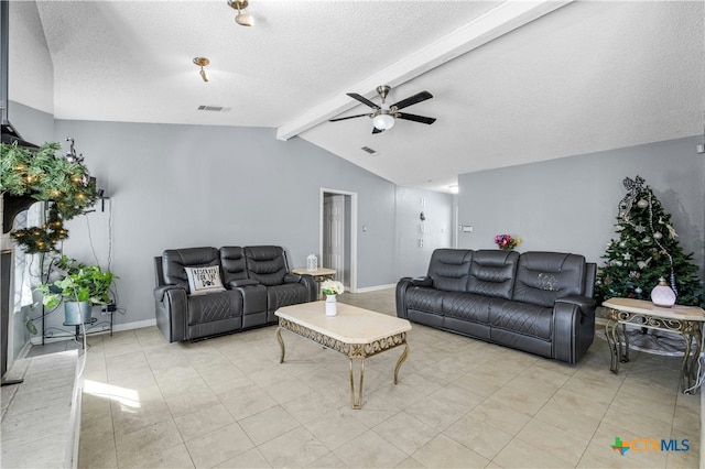 living room featuring ceiling fan, lofted ceiling with beams, and a textured ceiling