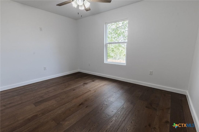 1123 Ainsworth St, Gonzales, TX 78629 - empty room with a ceiling fan and dark wood finished floors