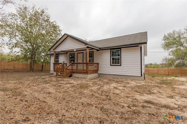 1123 Ainsworth St, Gonzales, TX 78629 - view of front of house with a porch and a shingled roof