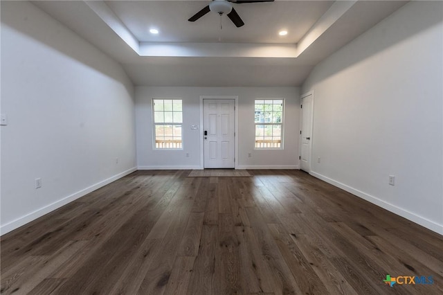 1123 Ainsworth St, Gonzales, TX 78629 - empty room featuring a raised ceiling, a ceiling fan, dark wood-style flooring, and recessed lighting