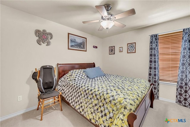 bedroom featuring baseboards, ceiling fan, and carpet flooring