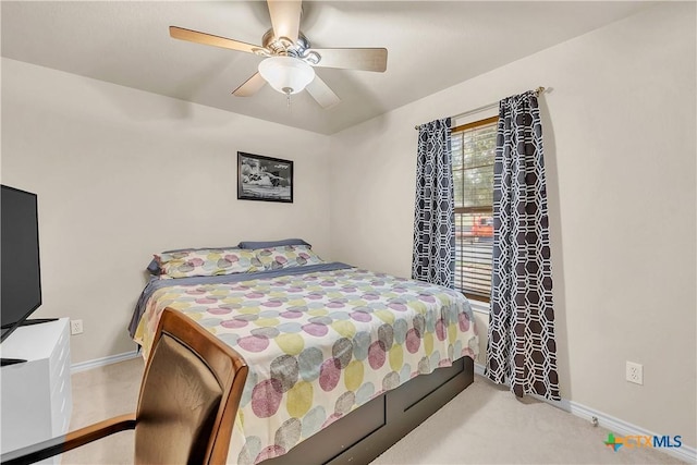 carpeted bedroom with baseboards and ceiling fan