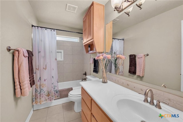 bathroom featuring tile patterned floors, visible vents, toilet, shower / tub combo, and vanity