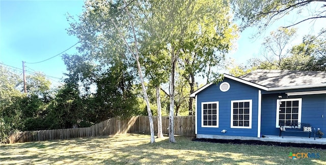 view of property exterior featuring a lawn