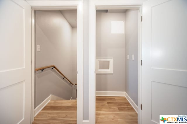 stairs with hardwood / wood-style floors