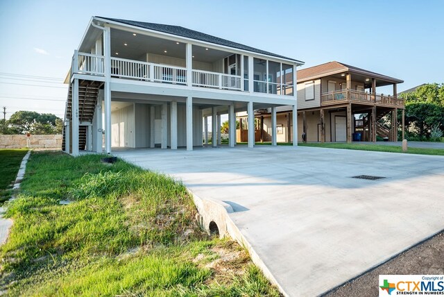 view of front of home with a carport