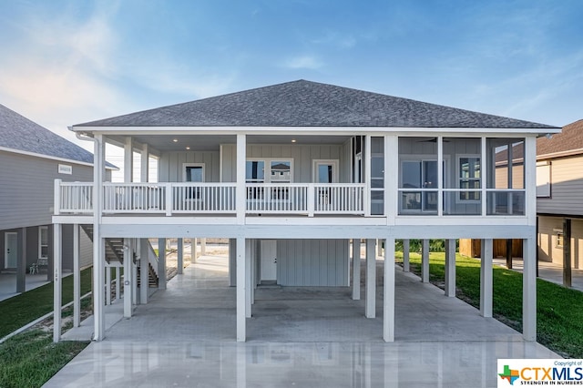 rear view of house featuring a carport