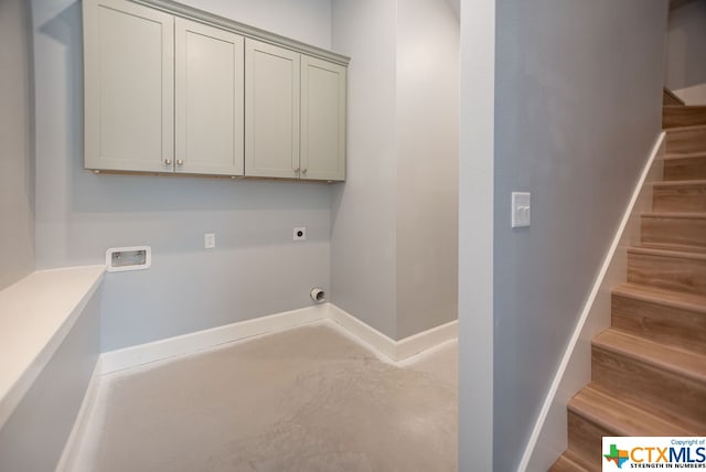 laundry area featuring cabinets, hookup for a washing machine, and hookup for an electric dryer