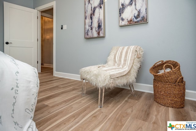 sitting room featuring light hardwood / wood-style flooring