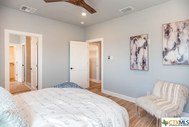 bedroom with light hardwood / wood-style floors and ceiling fan