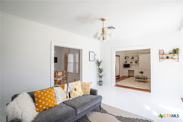 living area with ornamental molding, a notable chandelier, and visible vents