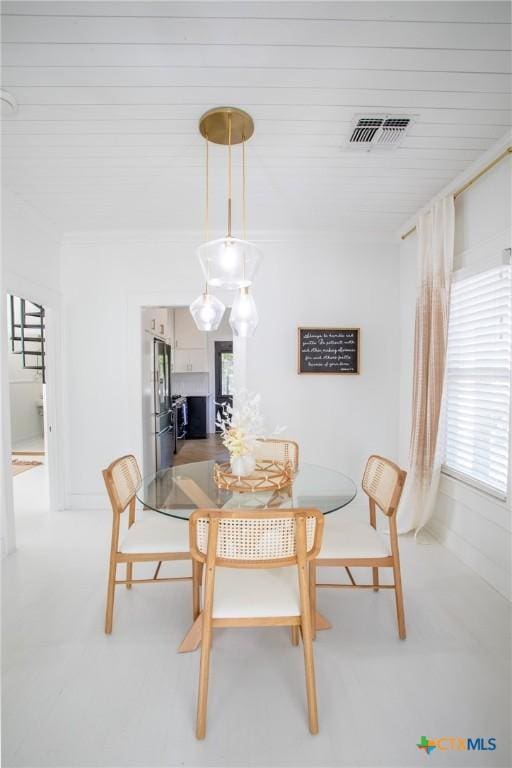 dining room featuring visible vents
