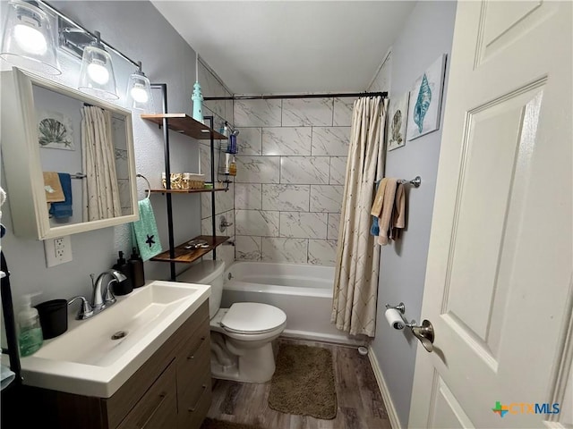 full bathroom featuring shower / tub combo, vanity, hardwood / wood-style flooring, and toilet