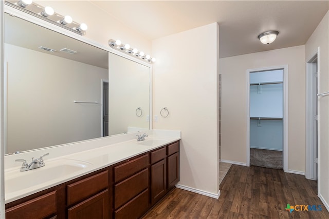 bathroom with vanity and hardwood / wood-style floors