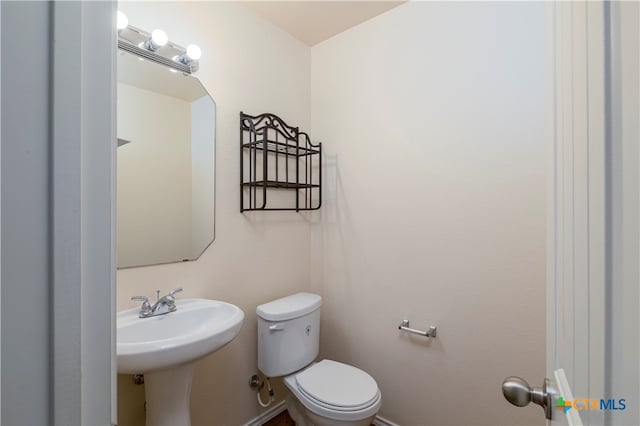 bathroom with sink and toilet