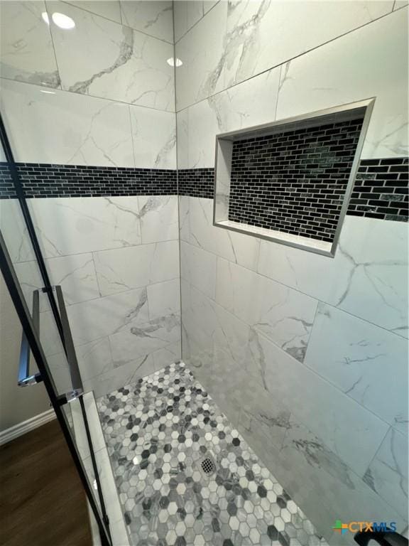 3004 Mayfair Dr, Victoria, TX 77901 - full bath with a tile shower and wood finished floors