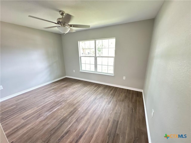 3004 Mayfair Dr, Victoria, TX 77901 - empty room featuring dark wood-type flooring, ceiling fan, and baseboards