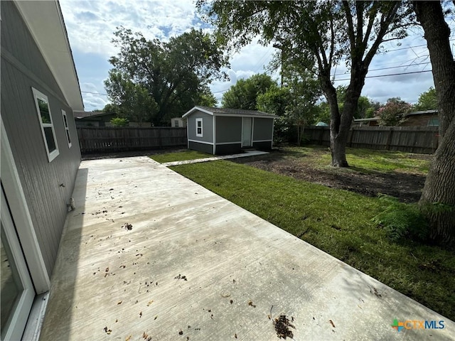 3004 Mayfair Dr, Victoria, TX 77901 - wooden deck with an outdoor structure and concrete driveway