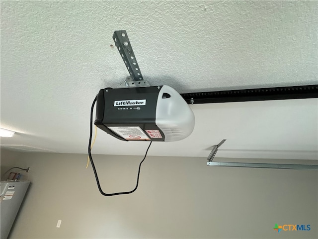 room details featuring a textured ceiling and a garage door opener