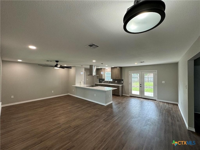 3004 Mayfair Dr, Victoria, TX 77901 - unfurnished living room with ceiling fan, dark wood-type flooring, baseboards, recessed lighting, and a sink