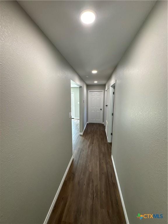 3004 Mayfair Dr, Victoria, TX 77901 - corridor featuring baseboards, dark wood finished floors, and recessed lighting