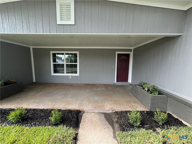 doorway to property featuring a patio area